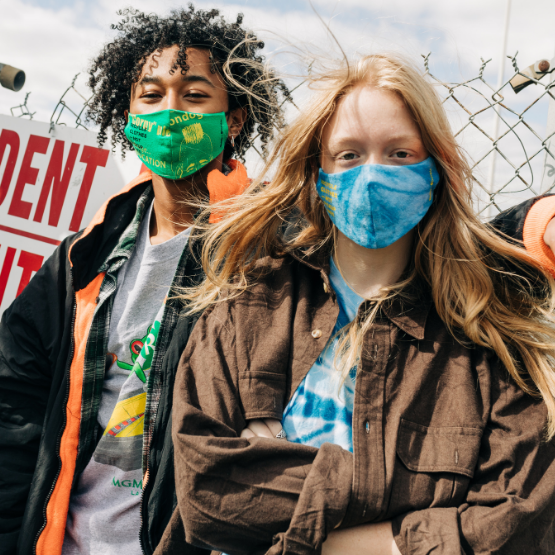 A man and a woman wearing Goodfair and Bumble reusable recycled fabric face masks