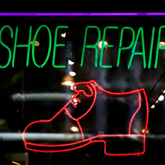 Neon shoe repair sign